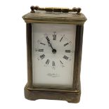 HENRY LEWIS & CO., A 20TH CENTURY GILT METAL CARRIAGE CLOCK Having white enamelled dial with Roman