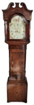 A GEORGE III OAK AND MAHOGANY LONGCASE CLOCK Wth eight day movement, striking on a bell, the arch