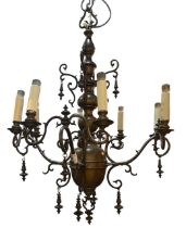 A HEAVY BRASS DUTCH CHANDELIER With four scrolling twin branch arms. (drop 85cm x diameter 60cm)