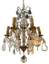 A DECORATIVE FRENCH LOUIS XV DESIGN GILT ORMOLU AND CRYSTAL GLASS SIX BRANCH CHANDELIER. (drop