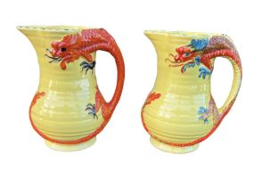 ARTHUR WOOD, POTTERY, TWO 20TH CENTURY DRAGON JUGS, CIRCA 1934 Both having yellow ground, stylised