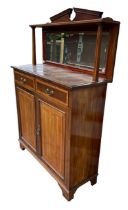 AN EDWARDIAN MAHOGANY AND INLAID MIRRORED BACK CABINET With two single drawers above a pair of