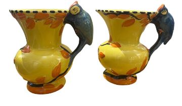 WADEHEATH, ENGLAND POTTERY, TWO ART DECO WOODPECKER JUGS, CIRCA 1930 All having yellow ground,