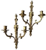 A PAIR OF FRENCH GILT BRONZE LOUIS XVI DESIGN TWO BRANCH WALL SCONCES Decorated with female facial