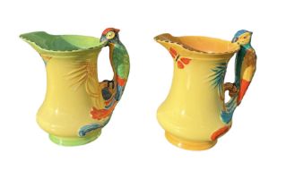 BURLEIGH WARE, POTTERY, TWO ART DECO PARROT JUGS, CIRCA 1930 All having yellow ground, stylised