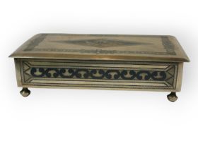 A MID 20TH CENTURY IRAQI/IRANIAN SILVER NIELLO RECTANGULAR CIGARETTE BOX Raised on four bunn feet,