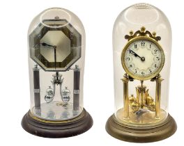 TWO 20TH CENTURY ANNIVERSARY METAL CLOCKS One being Art Deco style, underneath glass domes. (largest