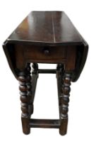 A 17TH CENTURY OAK GATELEG TABLE With single drawer, raised on bobbin turned legs. (h 70cm x d