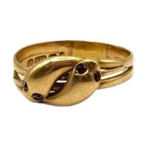 A VICTORIAN 15CT GOLD, DIAMOND AND RED SPINEL ENTWINED SNAKE RING Two snake heads with diamond and