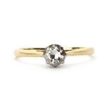 A gold single stone diamond ring,