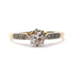 A gold single stone diamond ring,