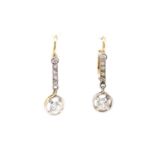 A pair of gold diamond drop earrings,