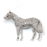 An 18ct white gold diamond set horse brooch, by Alabaster and Wilson,