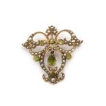 A gold peridot and split pearl brooch/pendant,