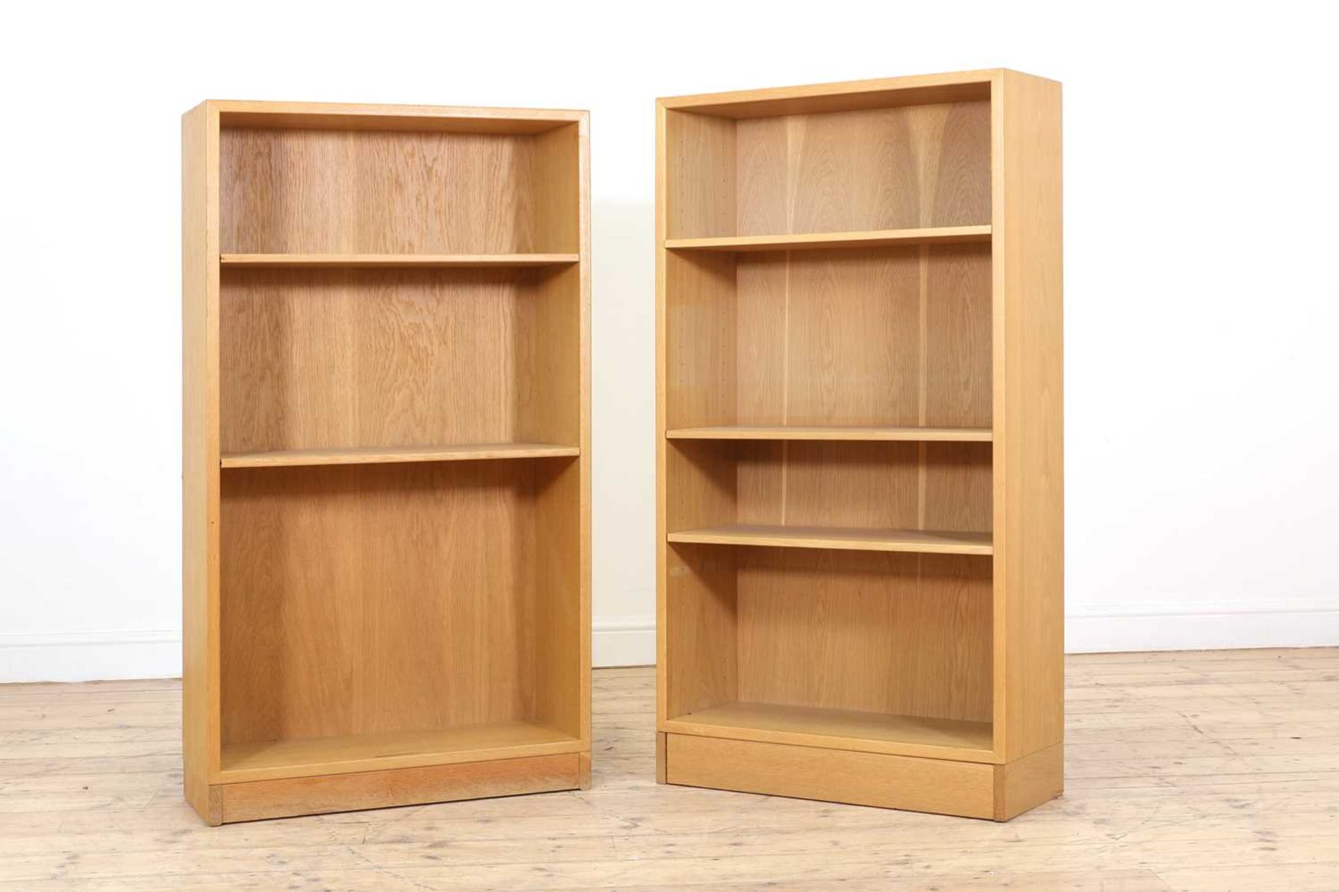 Two light oak open bookcases,