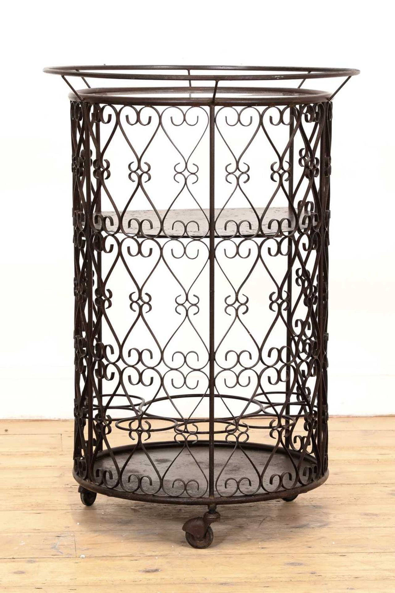 A patinated metal bar cart,