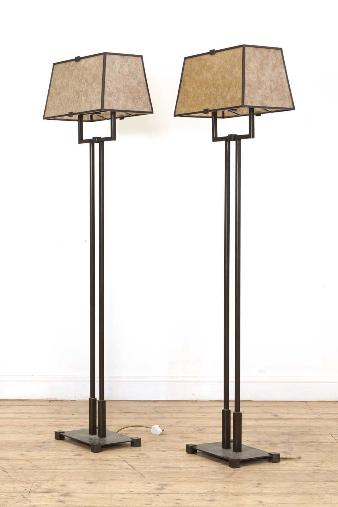 A pair of contemporary standard lamps,