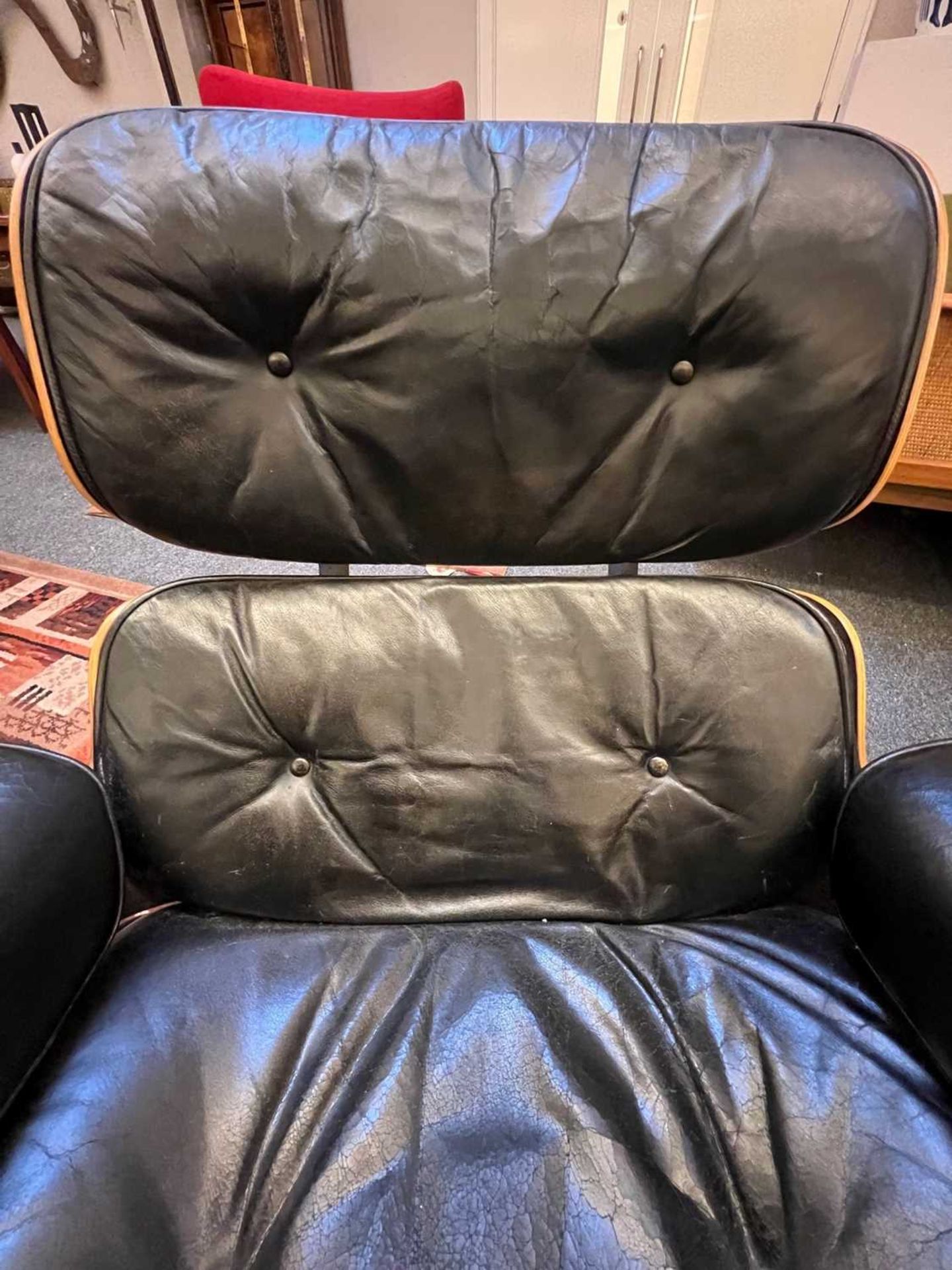 An Eames 'Model 670' and 'Model 671' rosewood lounge chair and ottoman, - Image 14 of 19