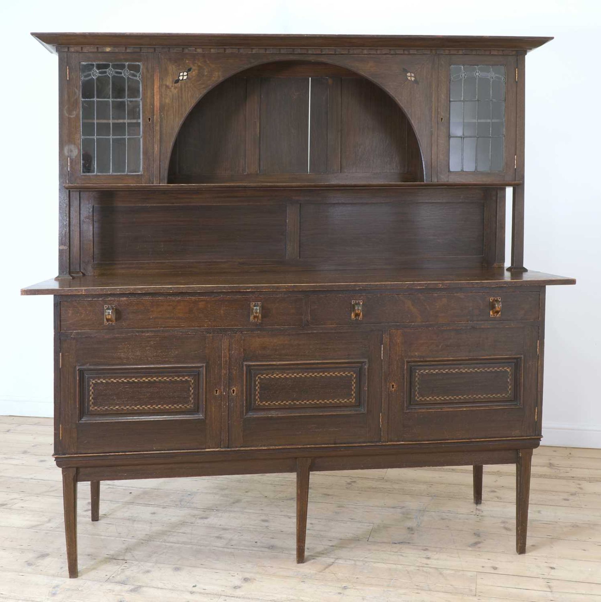 An Arts and Crafts inlaid oak sideboard,