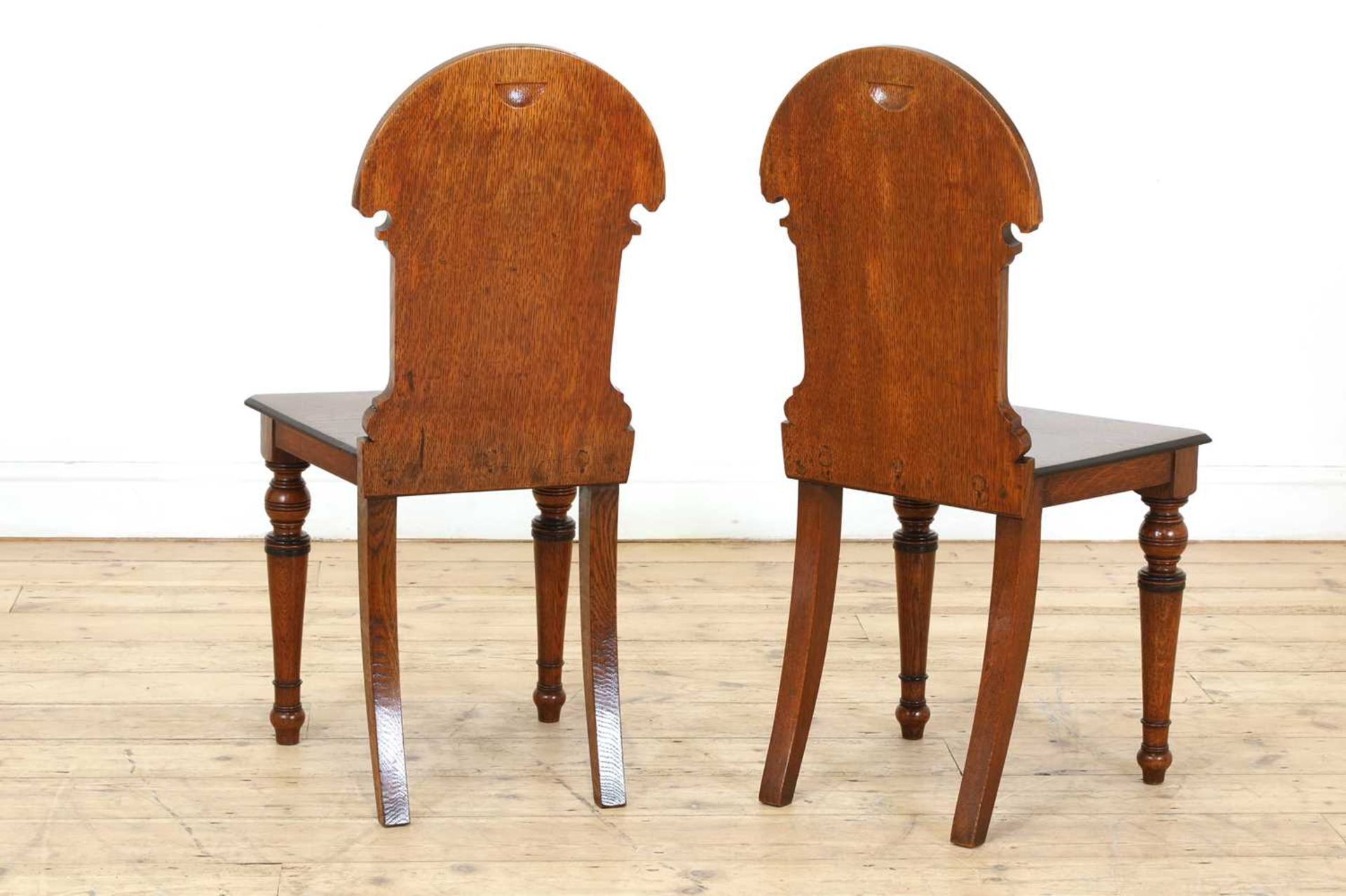 A pair of Aesthetic Movement oak and ebonised hall chairs, - Image 5 of 5