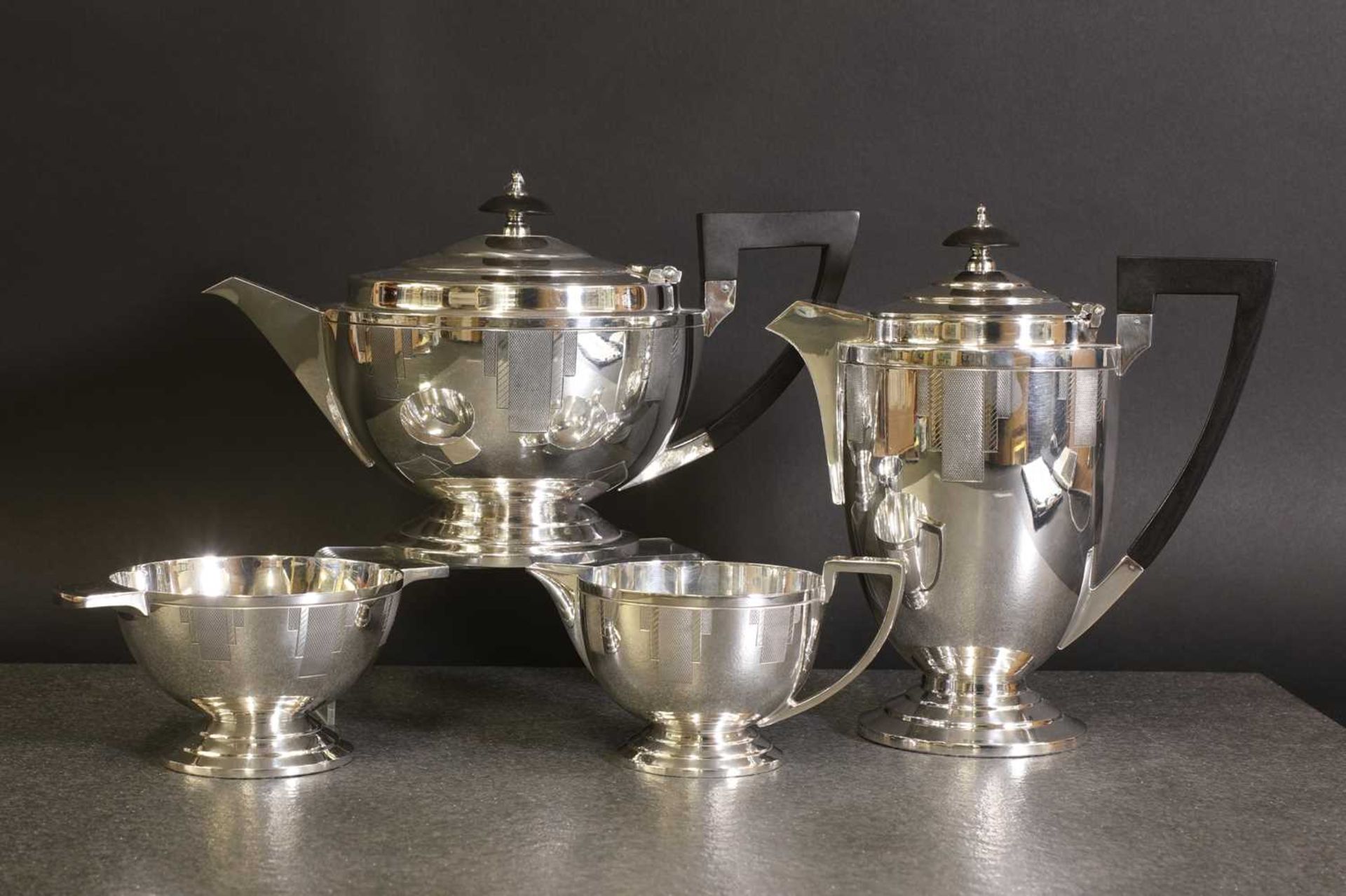 A Walker & Hall silver-plated four-piece tea set,