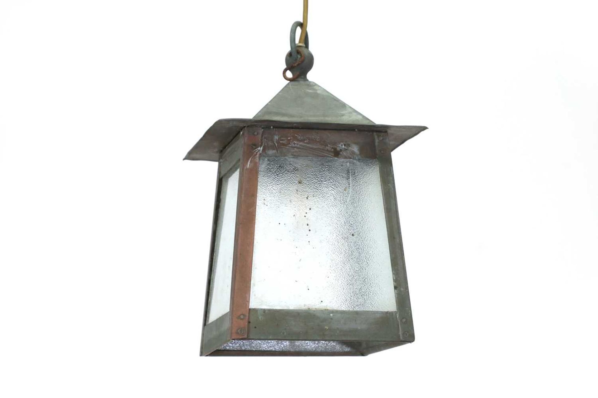 An Arts and Crafts-style hanging porch lantern,