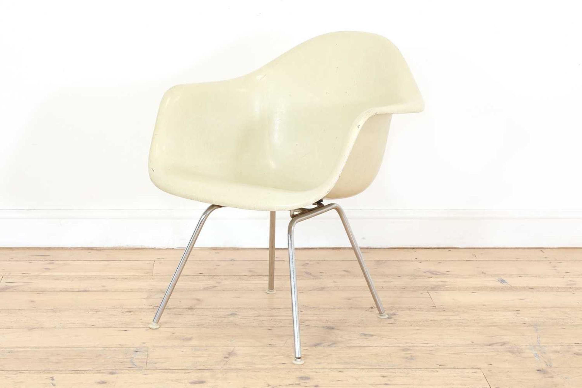 A white fibreglass armchair,