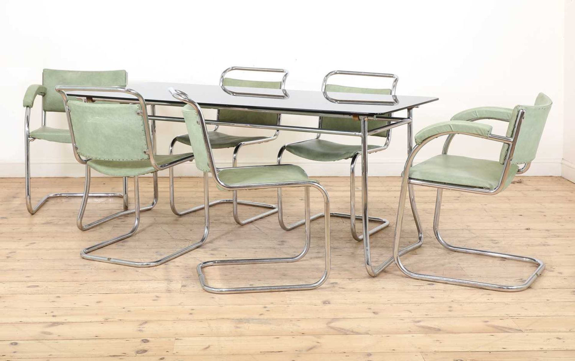 An Art Deco chrome dining table and six chairs