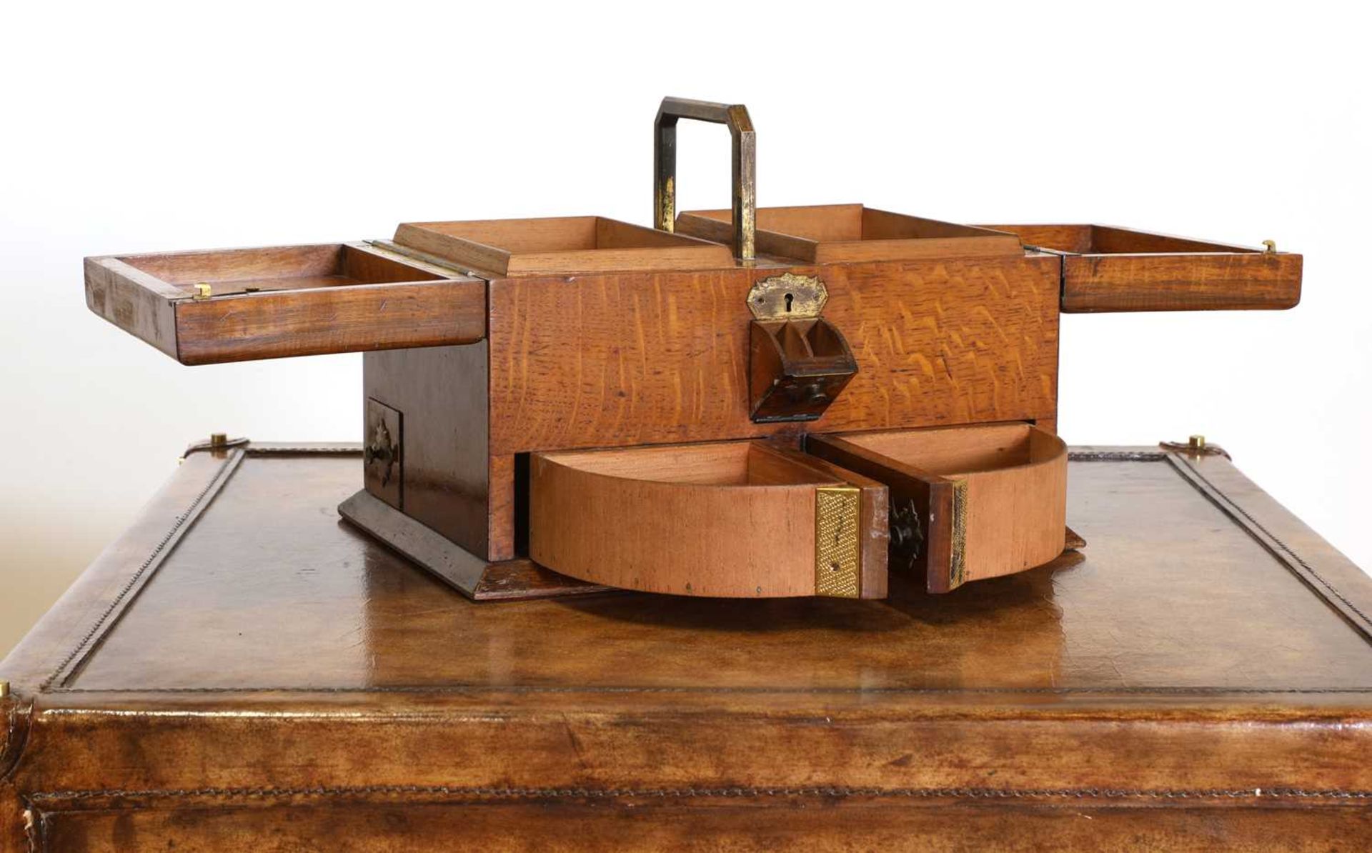 An Aesthetic Movement oak and brass-mounted cigar box,