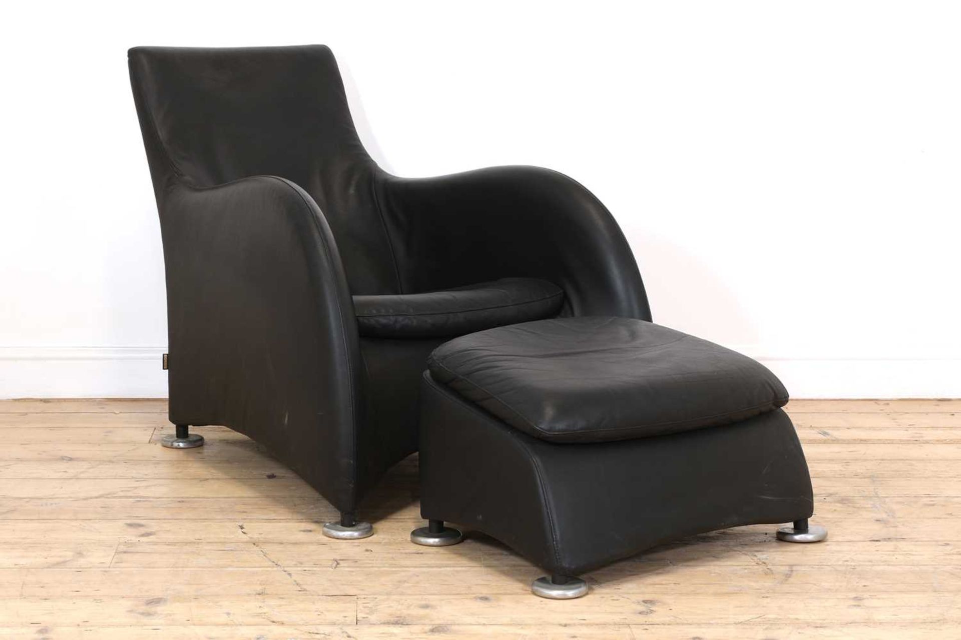 A leather lounger and ottoman,