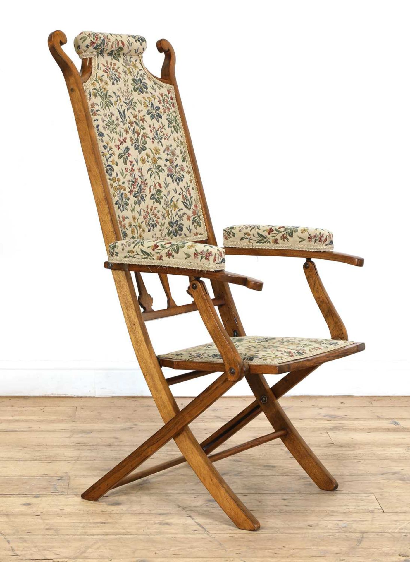 An Arts and Crafts folding upholstered chair,
