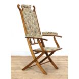 An Arts and Crafts folding upholstered chair,