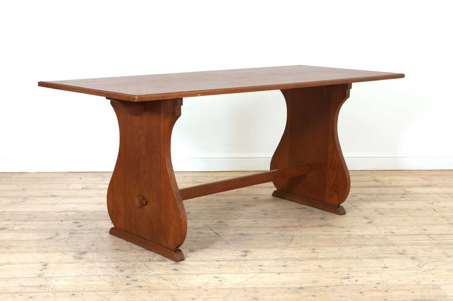 A teak refectory table,