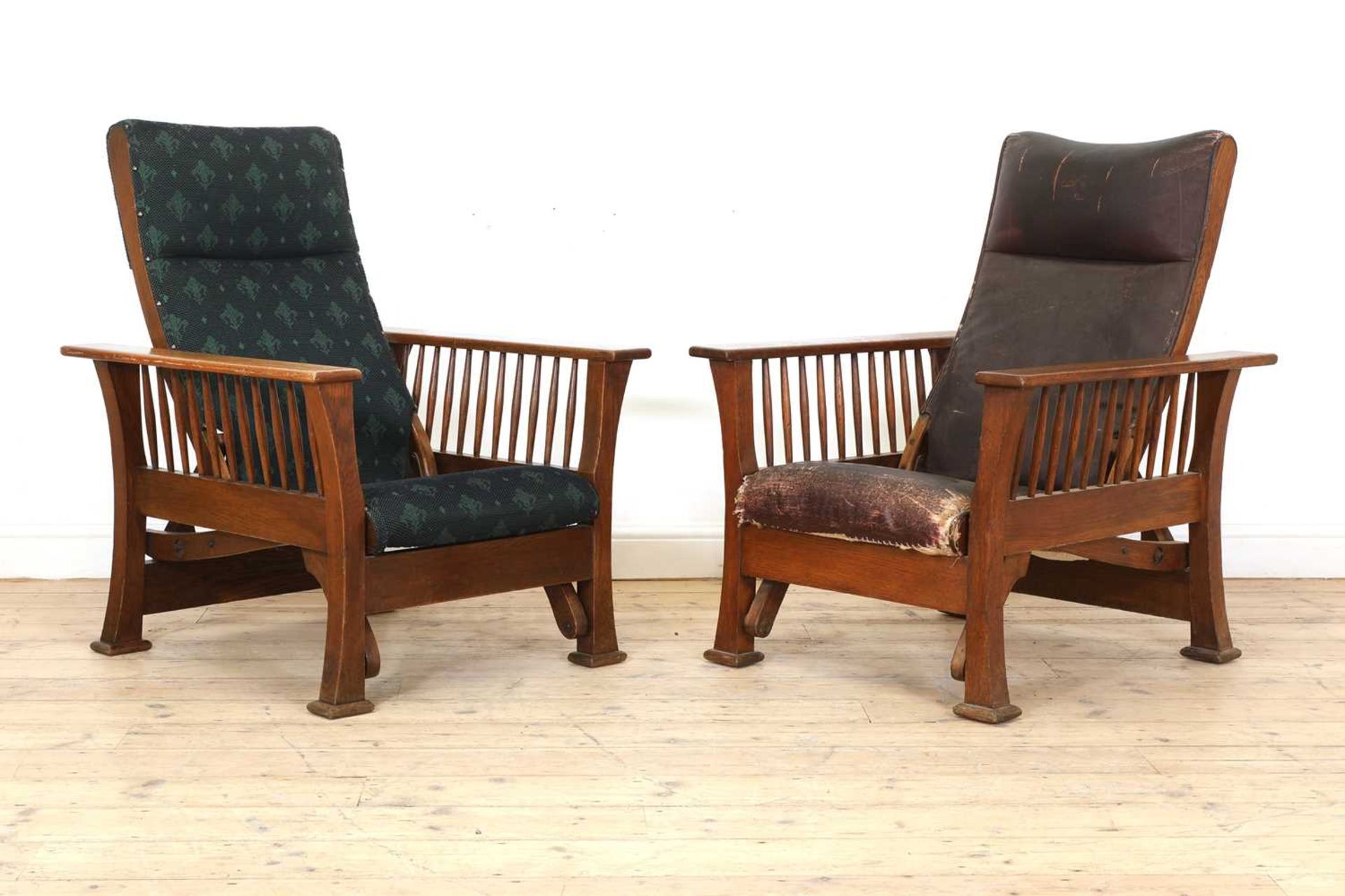 Two similar Arts and Crafts oak loungers,