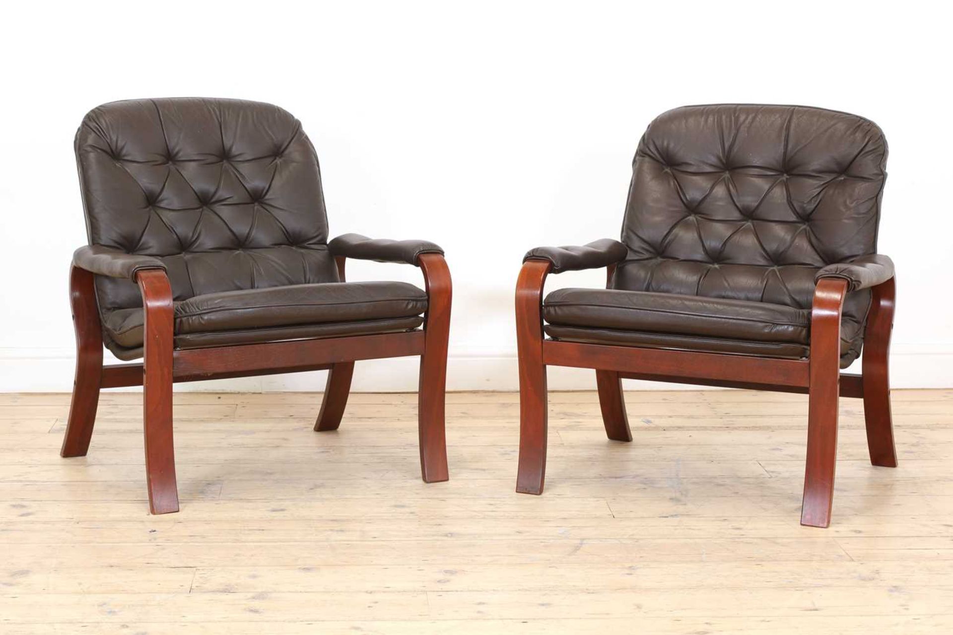 A pair of Swedish brown leather and bentwood lounge chairs,