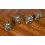 Four cast bronze terminal 'panther heads',