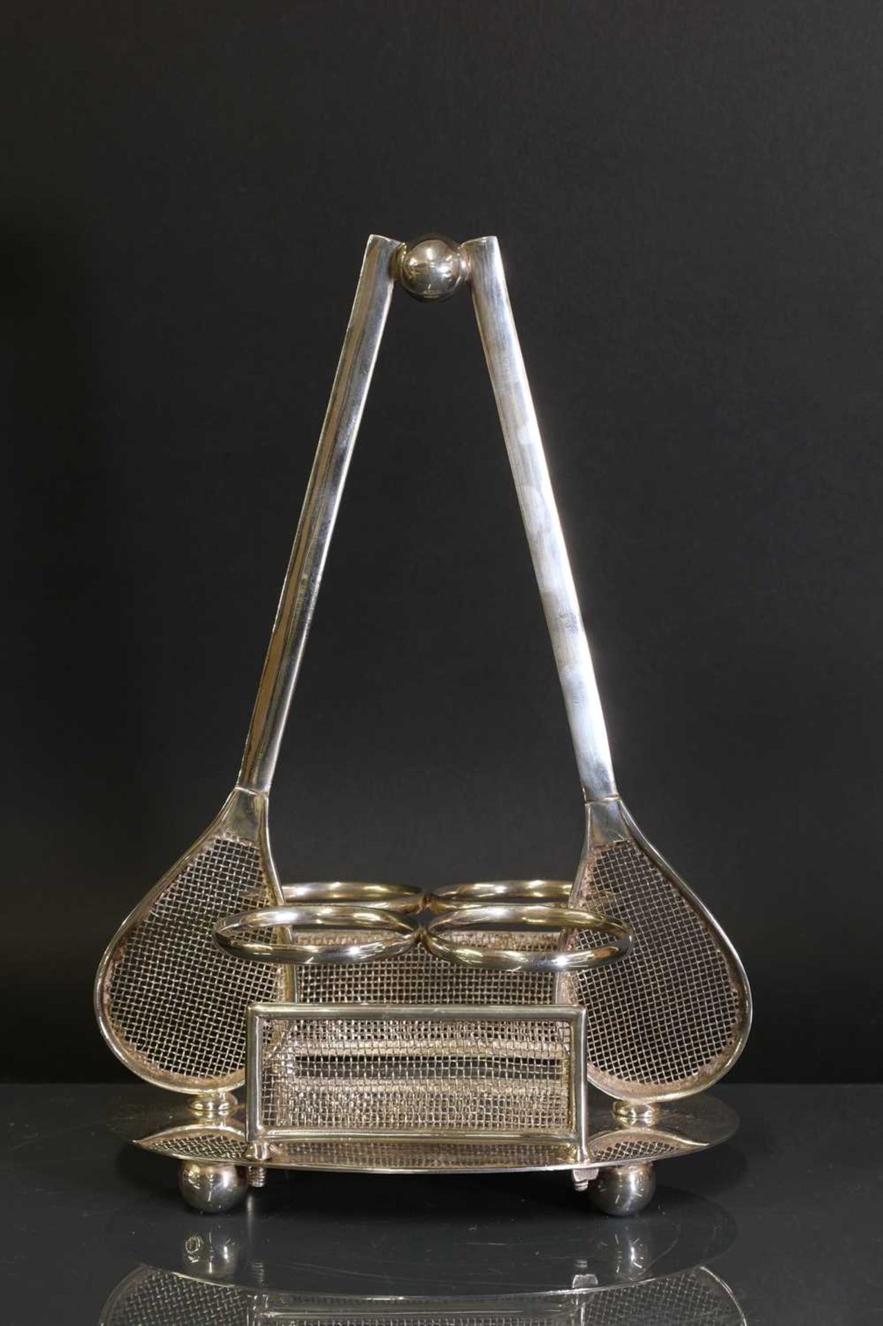 A novelty silver-plated 'tennis' condiment set,