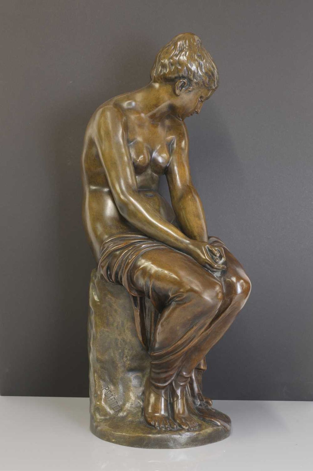 A patinated bronze figure of a seated nude, - Image 2 of 7