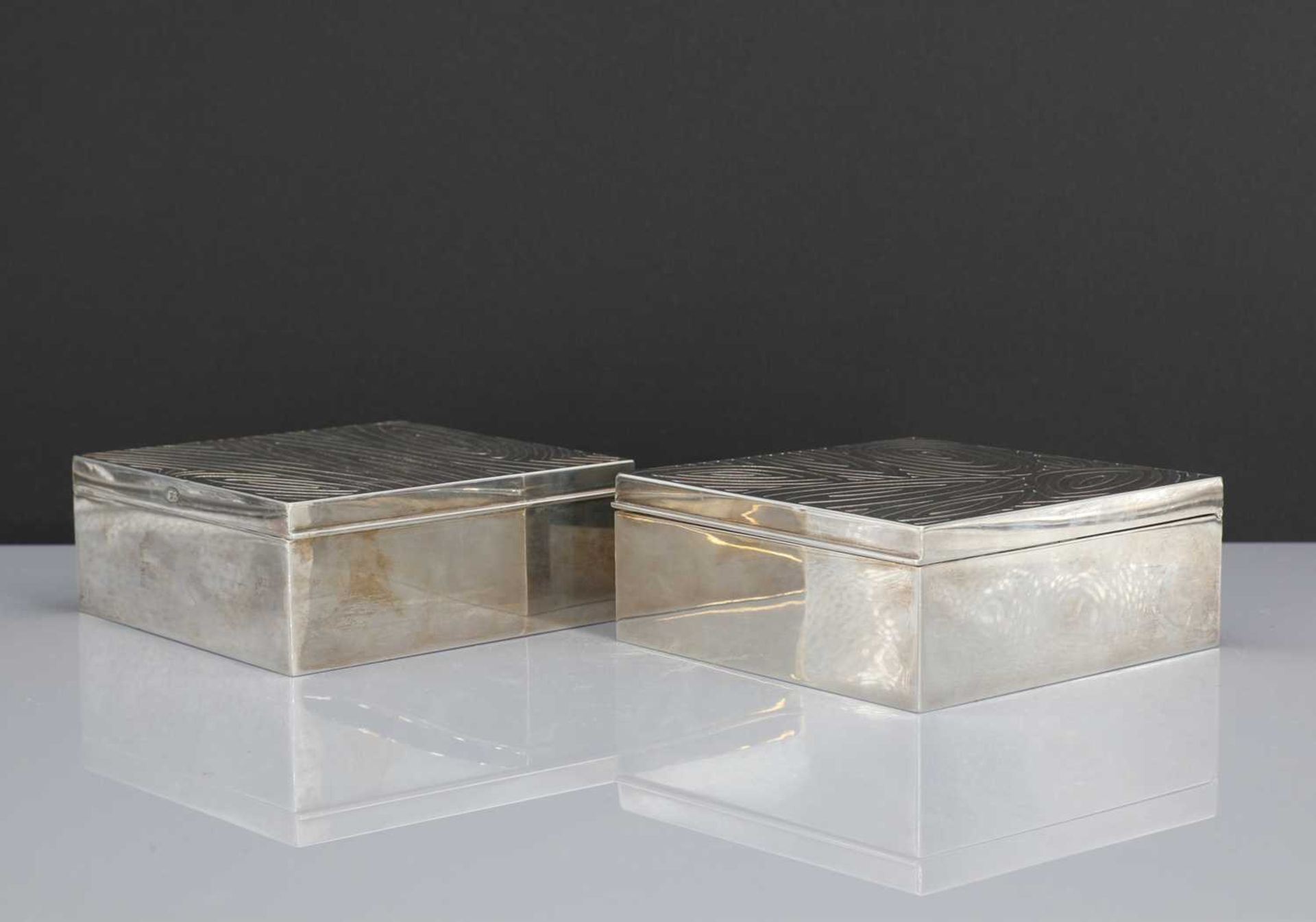 A pair of silver table boxes,