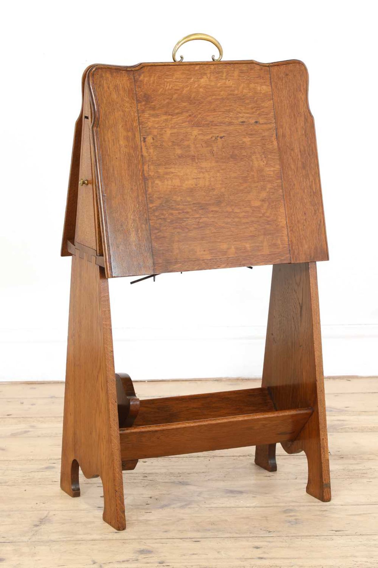 An oak folio stand, book trough and pipe drawer,