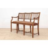 A Cotswold School oak chair-back settee,