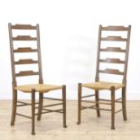 A pair of Arts and Crafts oak side chairs,