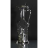 An Art Nouveau pewter and glass claret jug,