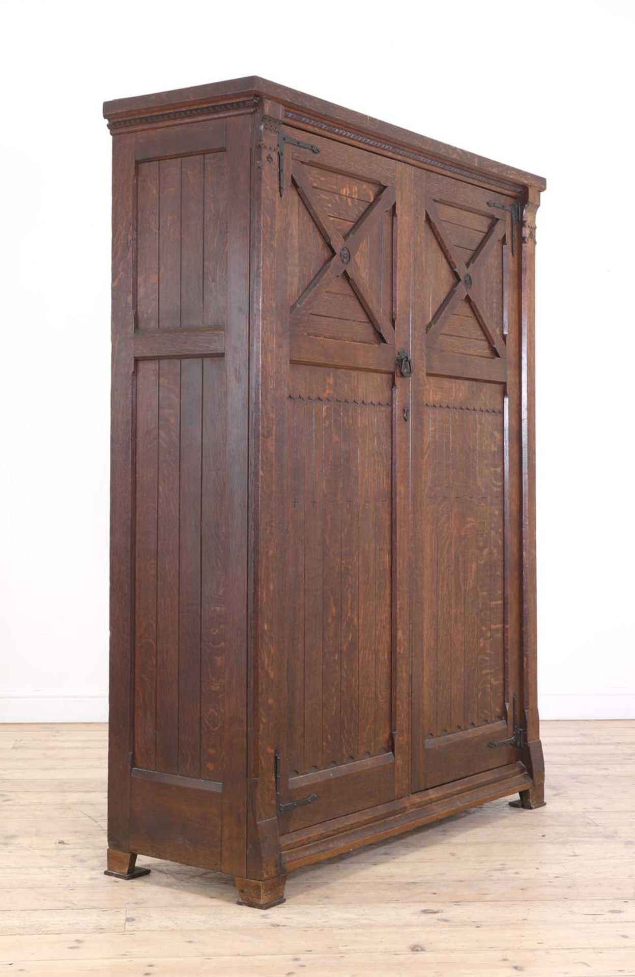 An Aesthetic Movement oak wardrobe,