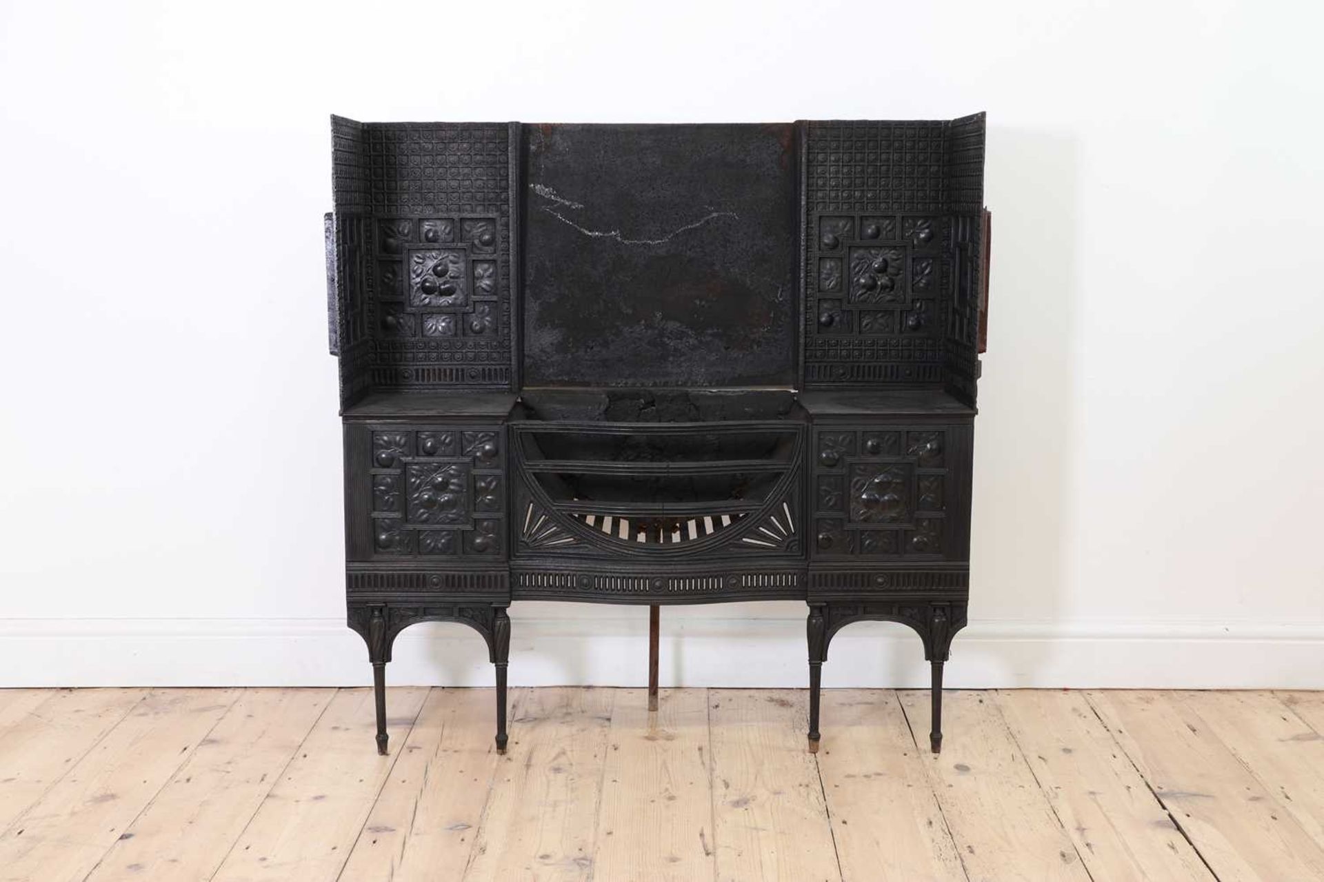 An Aesthetic Coalbrookdale cast iron fireplace,