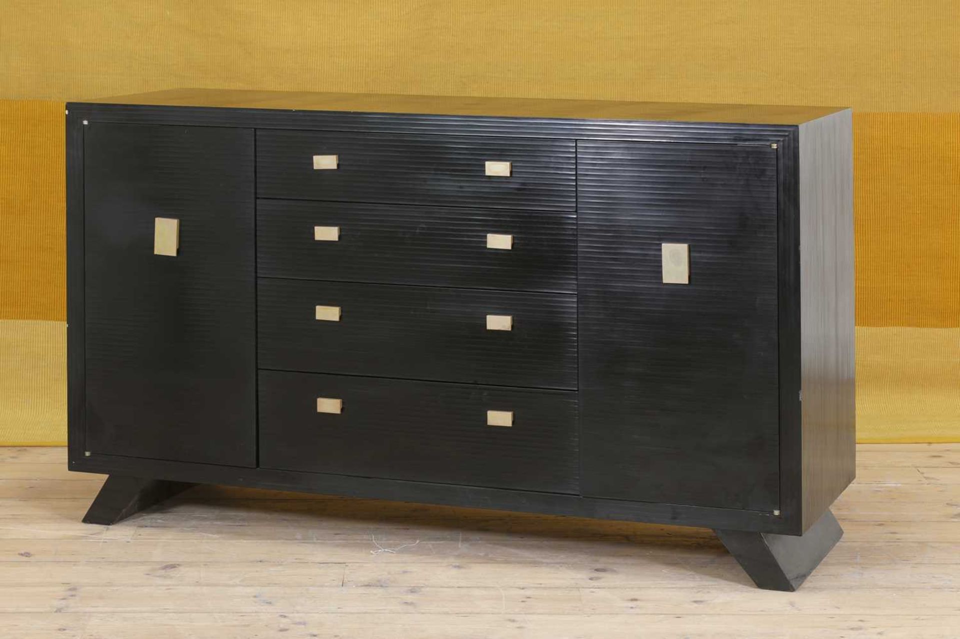 A black-lacquered credenza,