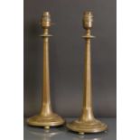 A pair of Arts and Crafts bronze candlesticks,