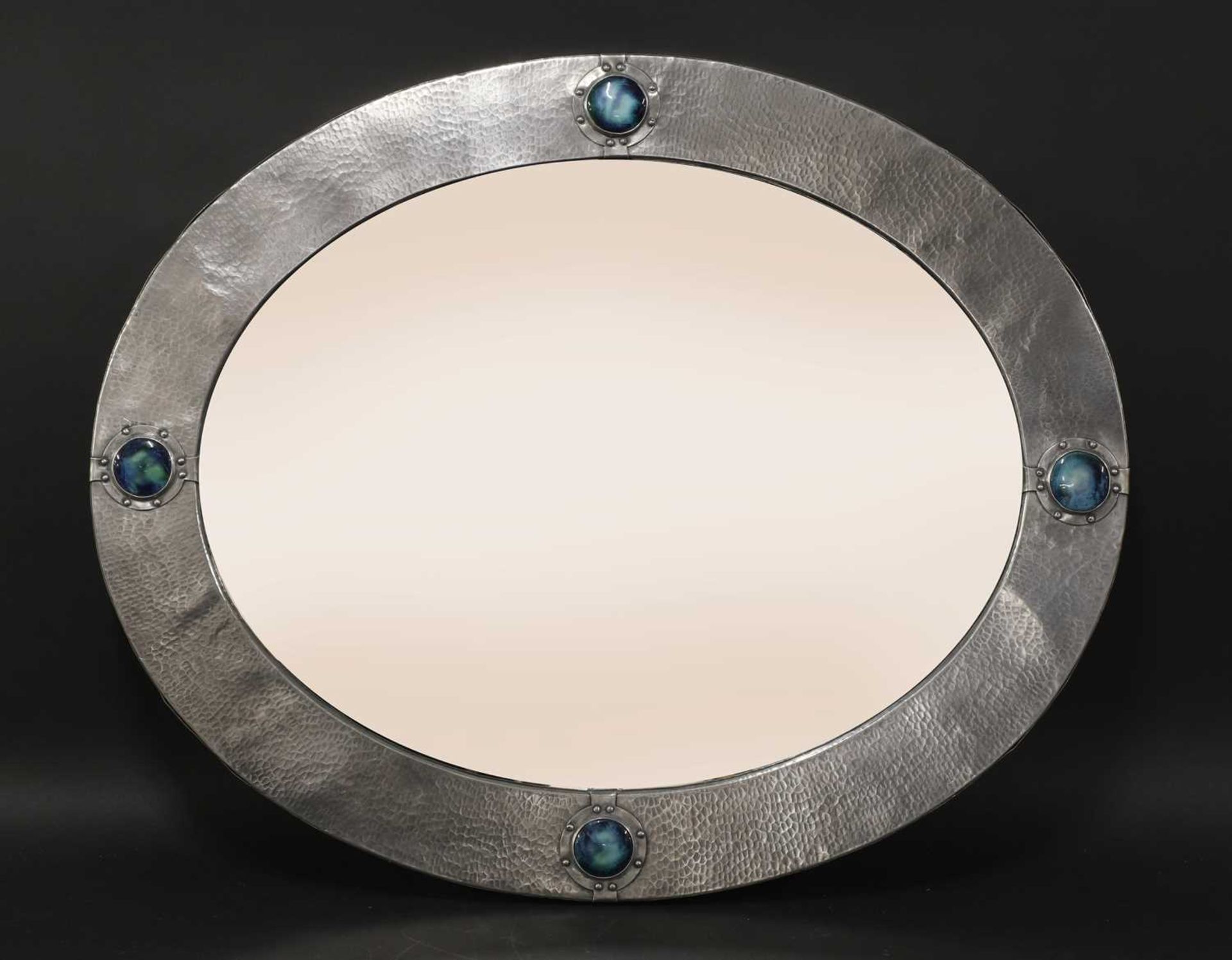 A Liberty & Co. oval pewter mirror,