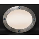 A Liberty & Co. oval pewter mirror,