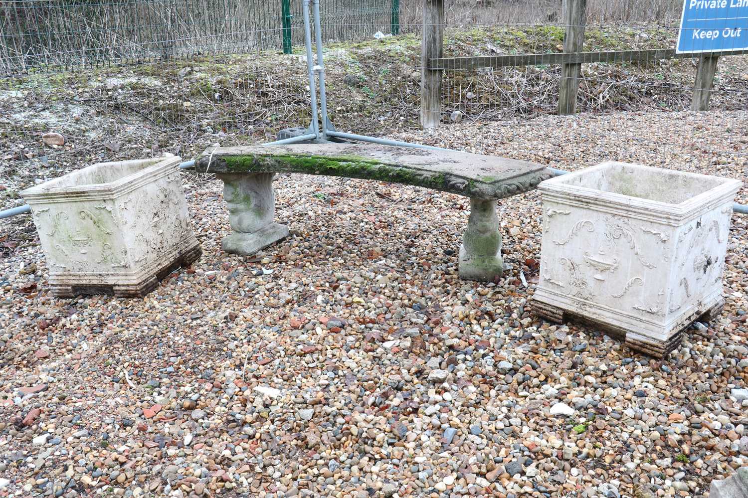 A composite stone garden bench